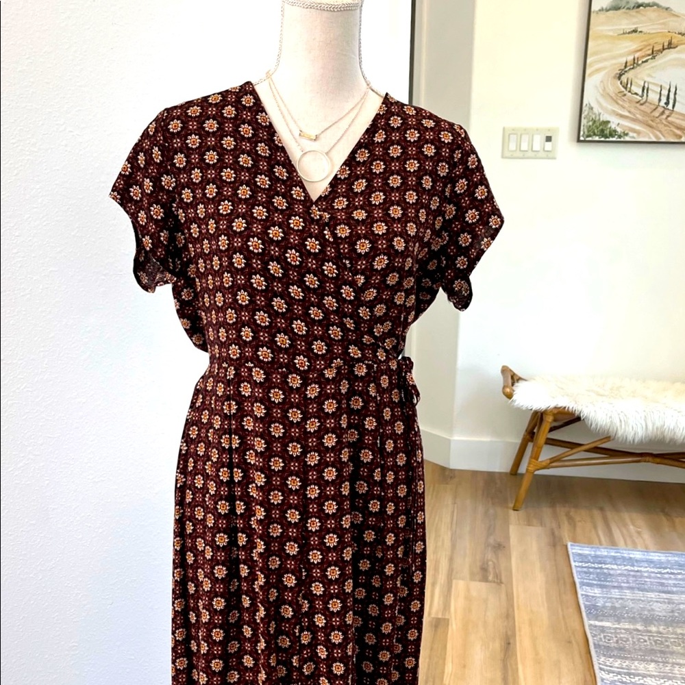 Cute faux wrap jumpsuit with zipper back and flattering fit. Perfect for Summer!